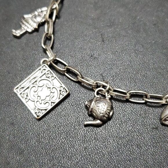 Silver tone Alice in wonderland themed bracelet up to 10" - Picture 3 of 10